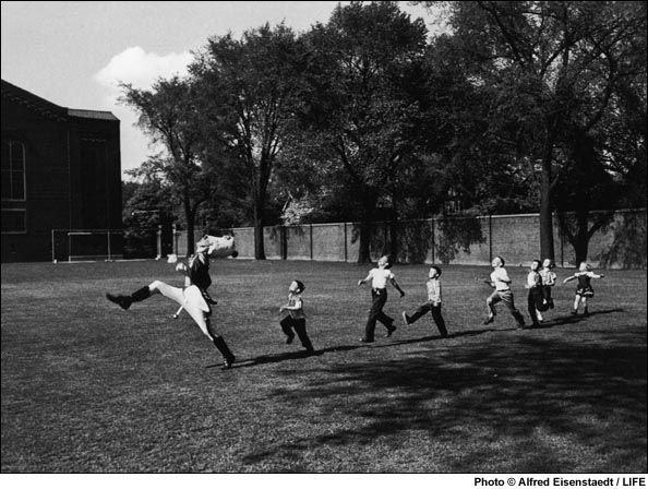 Children follow the Drum Major at the University of Michigan, 1950.